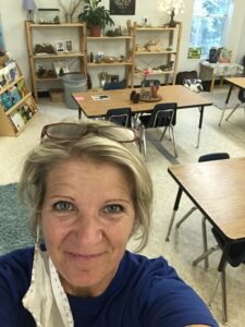 Mrs. Spranger smiling in her Science classroom.