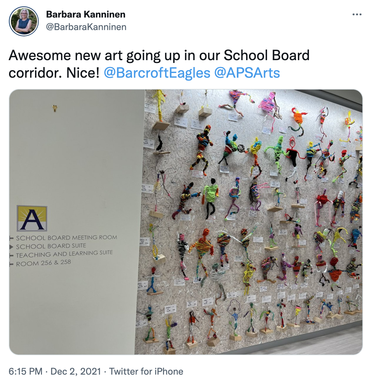 A tweet that reads "Awesome new art going up in our School Board corridor. Nice!"