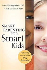 The book title Smart Parenting for Smart Kids next to images of a black and white child