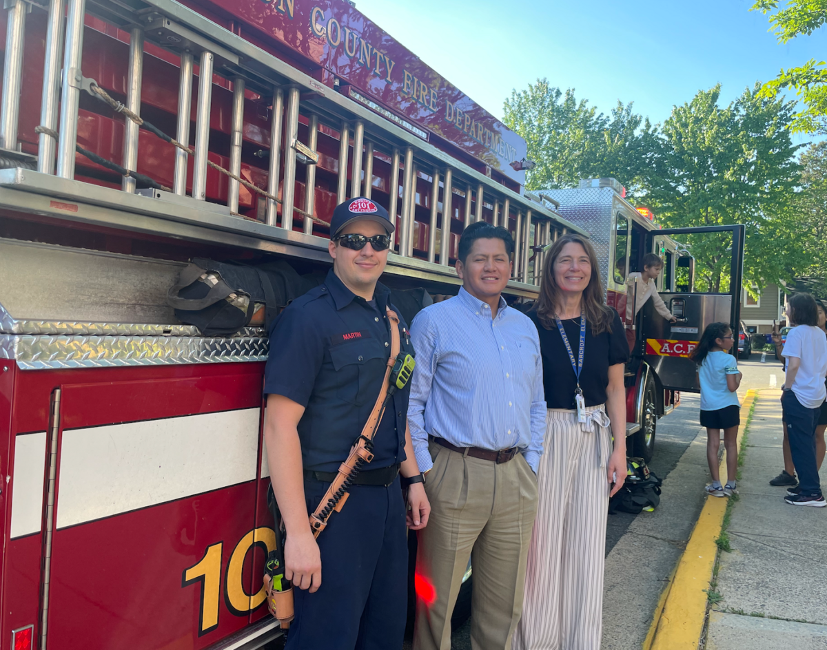 Ms. AB and Mr. Flores with guests from the Arlington County Fire Department
