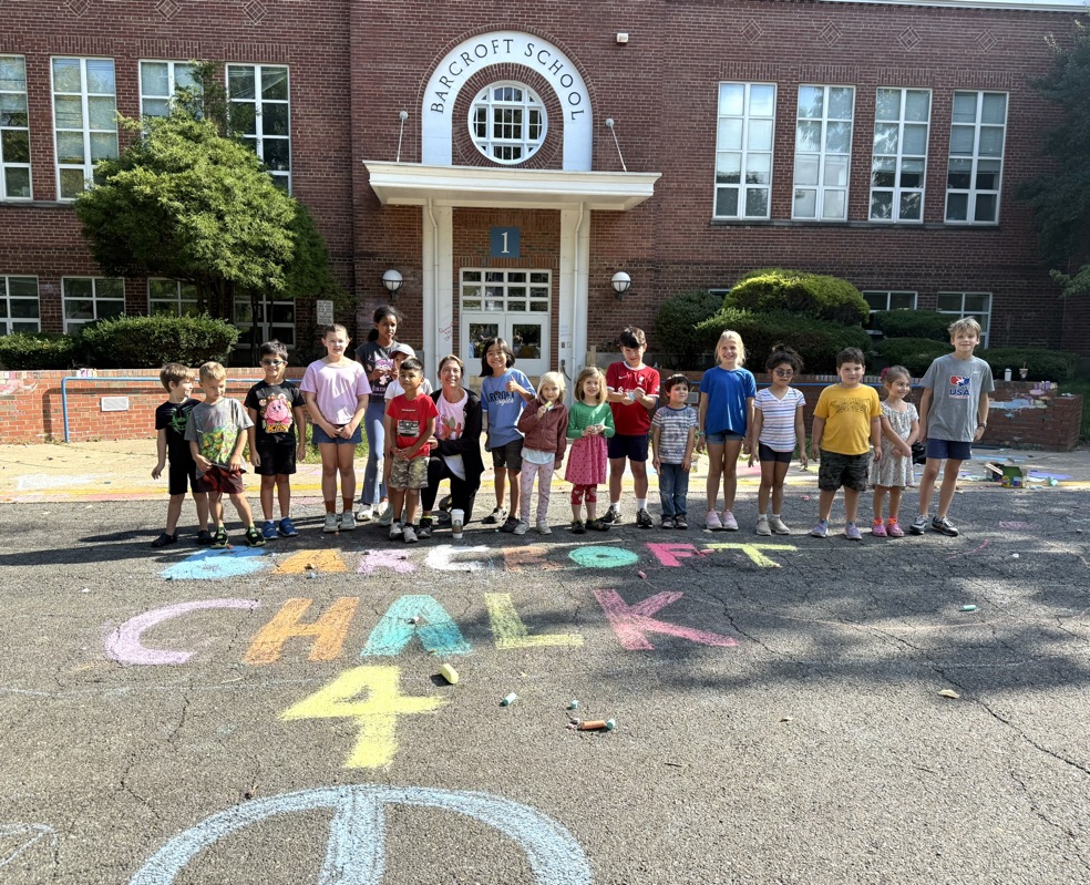 Chalk for Peace student participants standing in front of the school with Mrs. AB!